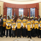 President Barack Obama and first lady Michelle Obama pose with the Jackie Robinson West All Stars Little Baseball League in the Oval Office of the White House in Washington, D.C., Nov. 6, 2014.
YURI GRIPAS/AFP/Getty Images